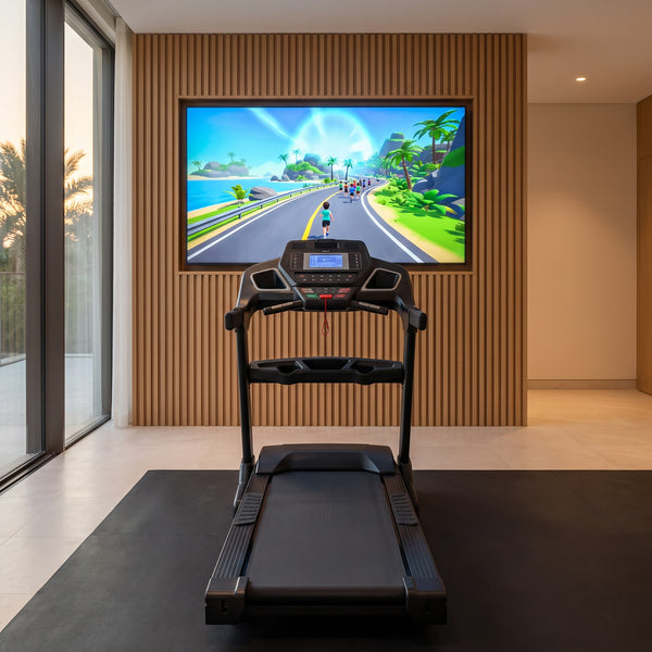 Sole F63 treadmill with Zwift virtual running on a wall screen in a Dubai villa home gym